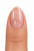 Applying nail glue gel to a prepared natural nail before attaching the press-on tip