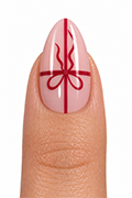 Applying the ribbon bow accent press-on nail as the feature design