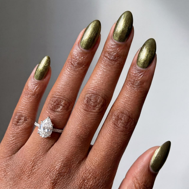 Shimmer olive green nails with subtle glitter